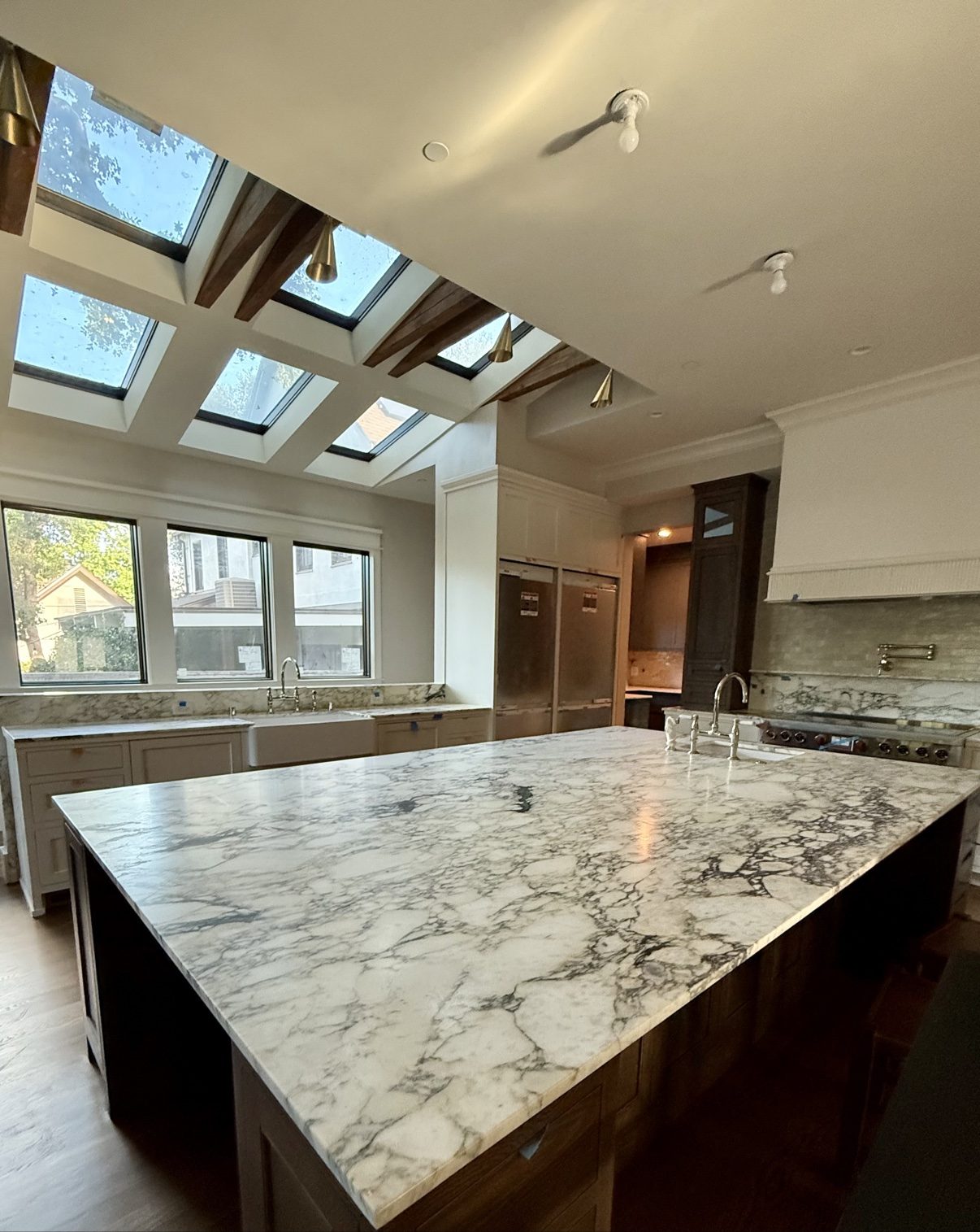 Kitchen remodel with skylights and marble island